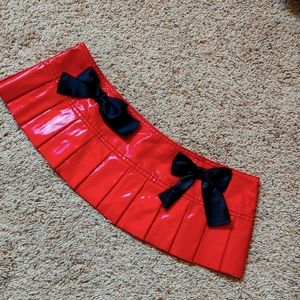 Pleather pleated mini skirt with bows and garters